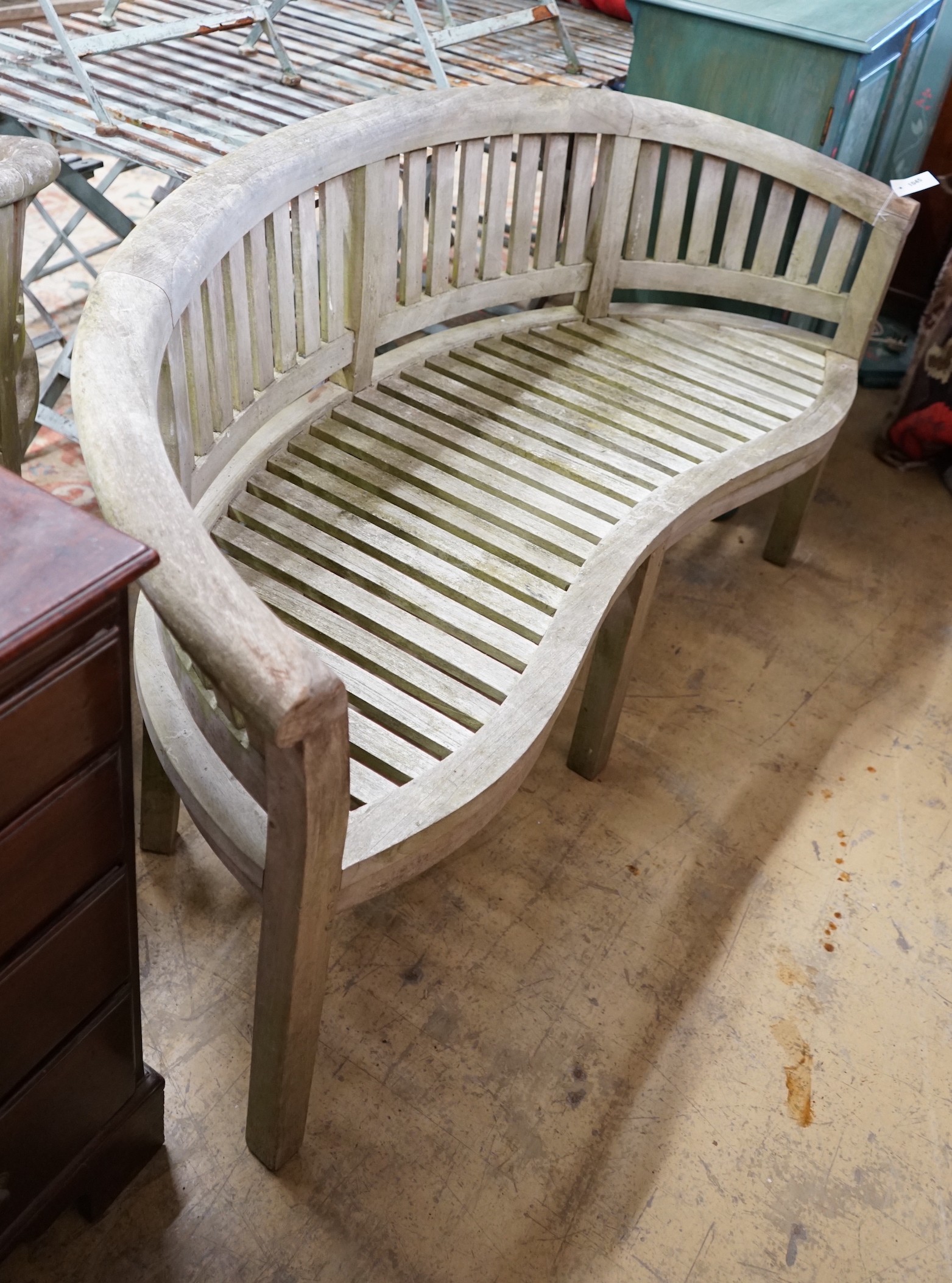 A weathered teak garden banana bench, length 160cm, height 84cm